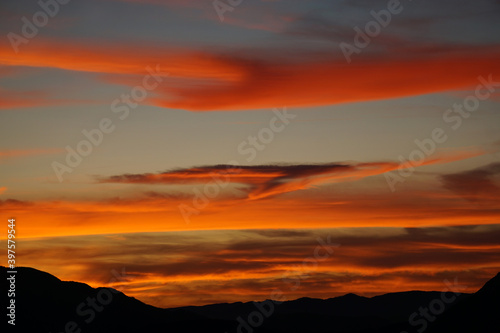 bright orange sunset over the mountains in the French Alps