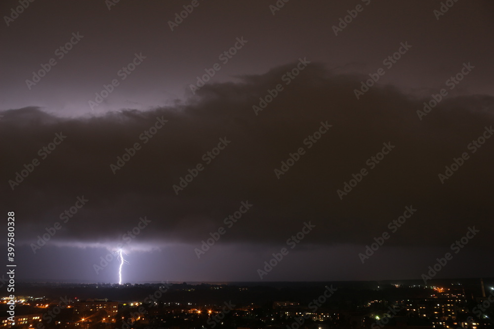 Lightning that comes out of the clouds in the sky and touches the ground.