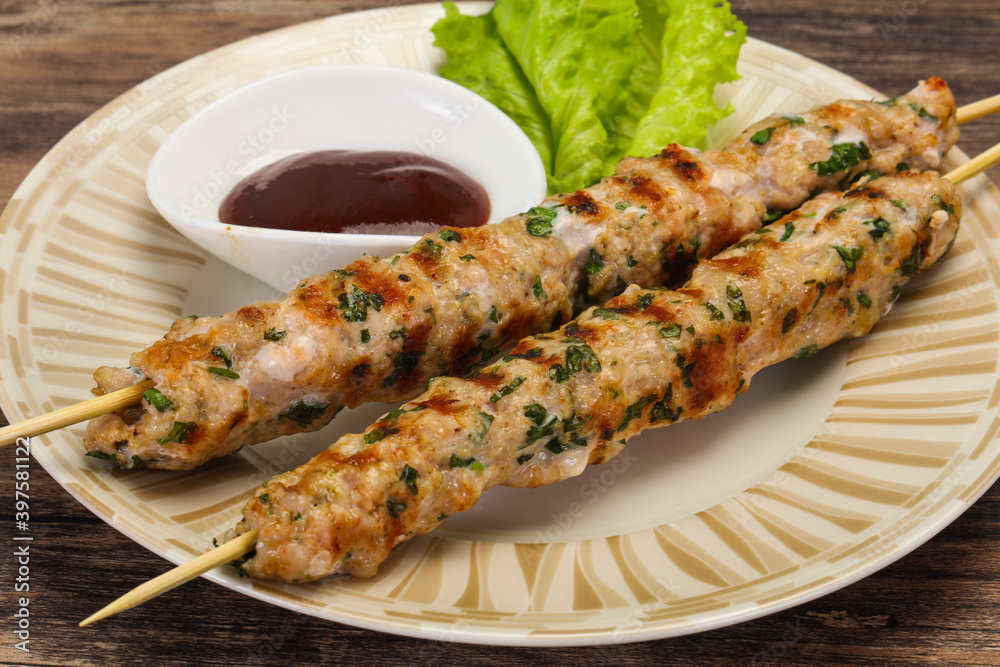 Minced pork skewer kebab with sauce