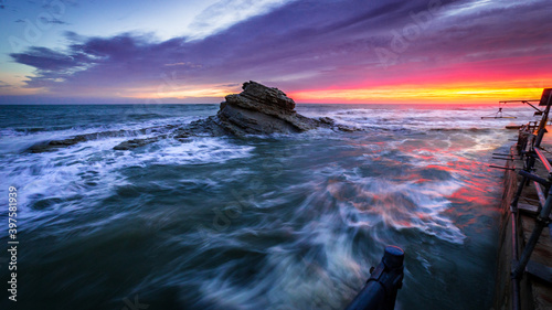 il mare in burrasca al Passetto di Ancona, in un giorno d'autunno all'alba photo