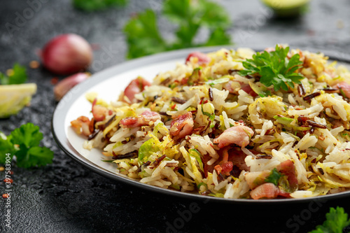 Fried Brussels sprouts with rice and crispy bacon