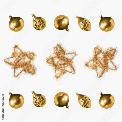 New Year and Christmas pattern. Glass decorations for the Christmas tree in a retro style around a homemade golden star on a white background. For background and packaging. photo