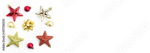 Christmas tree toys, red and gold stars, balls on a white background. Banner. Copy space