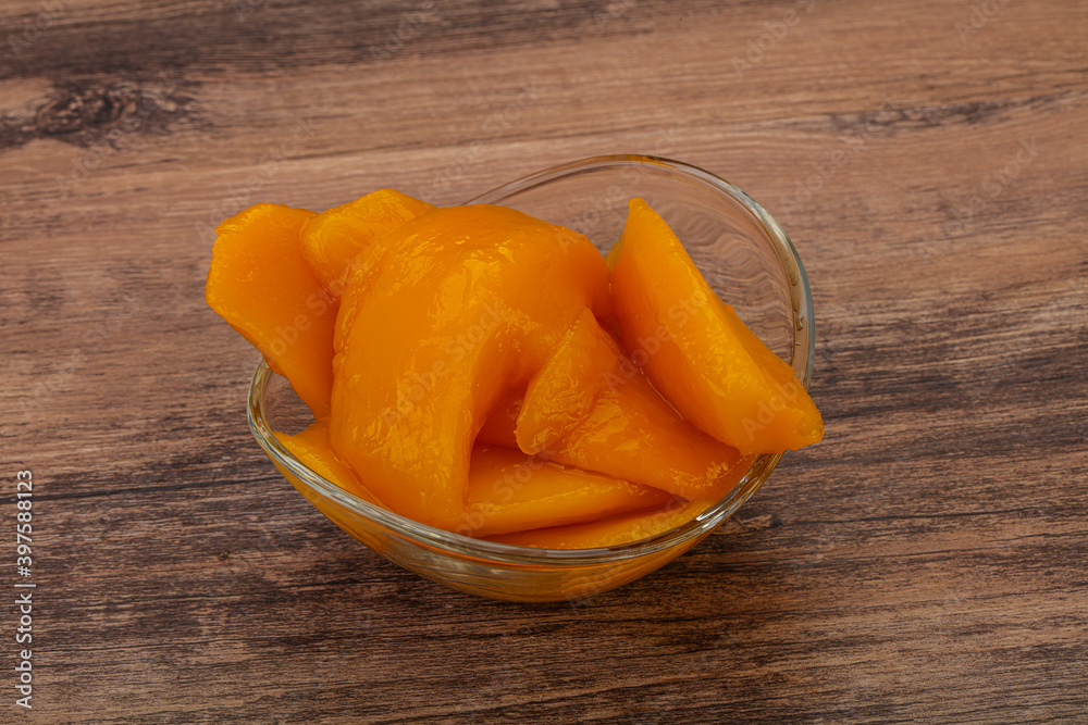 Sweet mango slices in syrop Sweet mango slices in syrop
