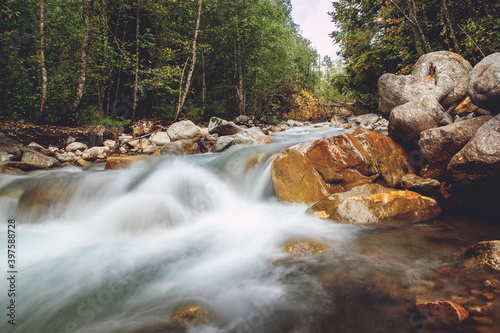 Wet rocks in mountain river near the nature reserve in Russia