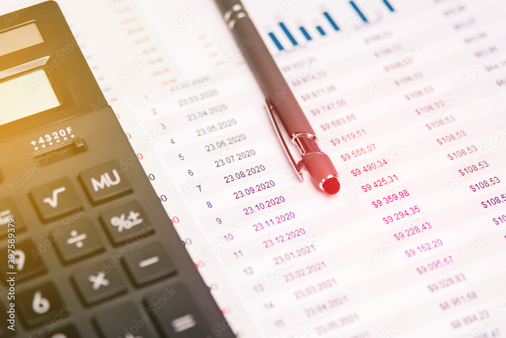 Accounting. Calculator, pen and documents with numbers at the workplace. Calculation of taxes. Accounting. Calculator, pen and documents with numbers at the workplace. Calculation of taxes.