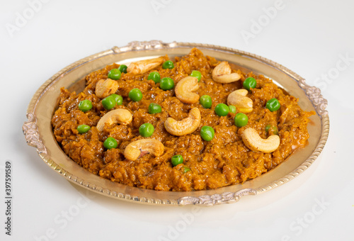 Rajasthani Famous Traditional Cuisine Haldi Sabji or Tukkar Served with Salad on White Background