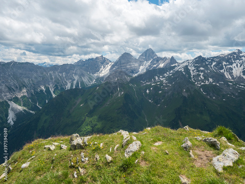 view from Pramarnspitze saddle on snow-capped moutain panorama at Stubai hiking trail, Stubai Hohenweg, Alpine landscape of Tyrol Alps, Austria. Summer blue sky, white clouds