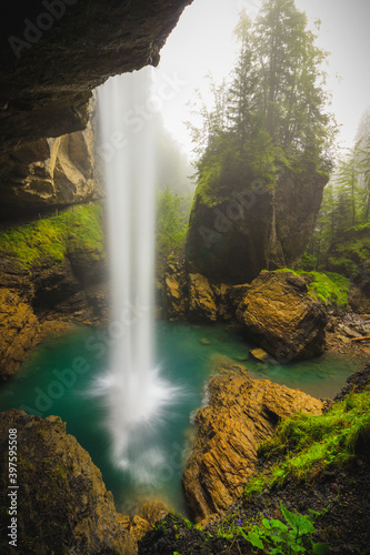 B  rglist  ber Berglist  ber Waterfall behind a waterfall green moody