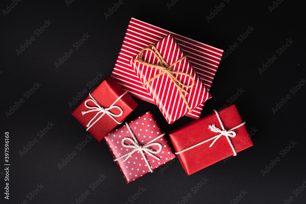 Group of red gift boxes on black background