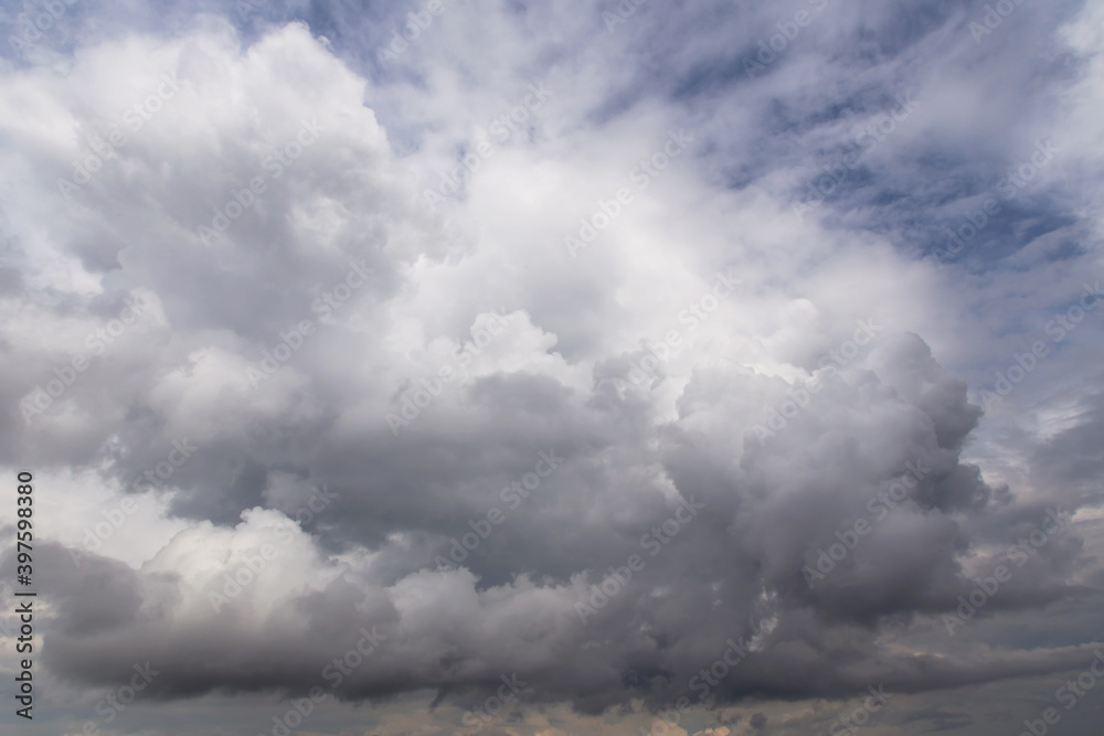 Storm sky, dark and white big cumulus cloud on blue sky background texture Storm sky, dark and white big cumulus cloud on blue sky background texture