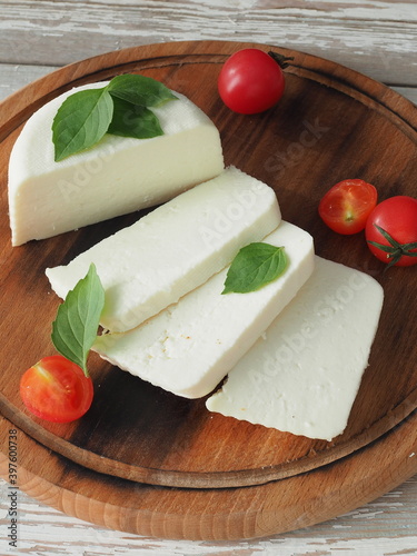 Farmer cheese on cutting board close up