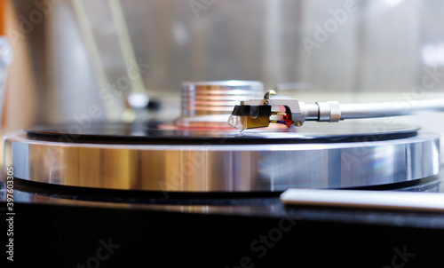 vinyl player playing record, headshell close up
