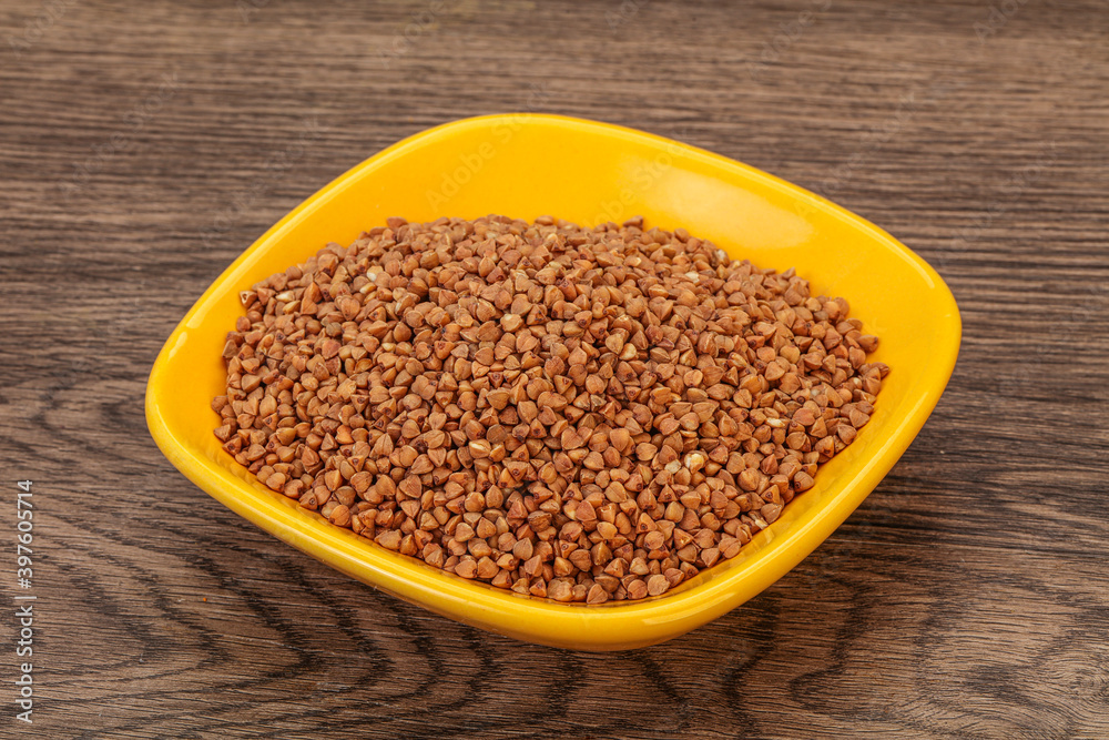 Raw buсkwheat cereal in the bowl Raw buсkwheat cereal in the bowl
