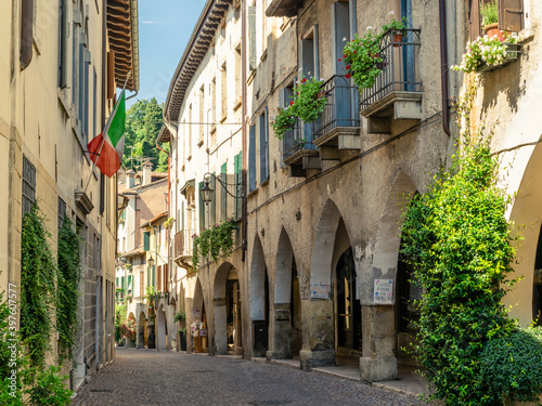 View of the arcades of the ancient village of Asolo in summer, Treviso, Italy