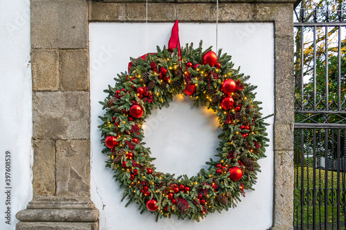 Large Christmas Wreath On White Background Bordered By  Stone and Copy Space