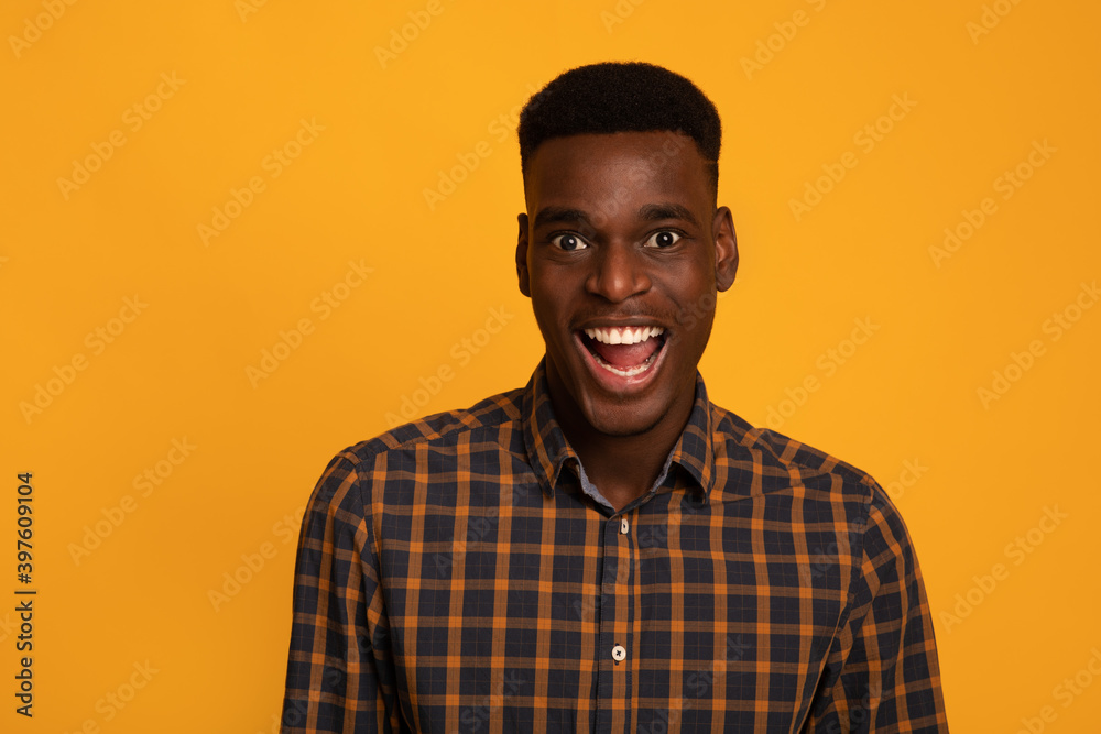 Fototapeta premium Portrait Of Excited Funny Black Guy Looking At Camera With Amazement