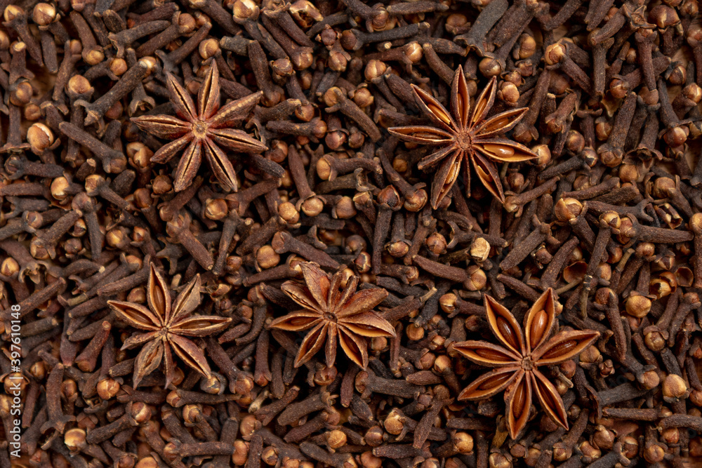 Heap of dried cloves and anise star, close up view. Heap of dried cloves and anise star, close up view.