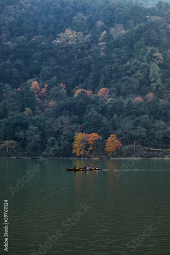 lake in autumn with a boat