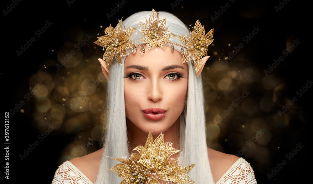 Attractive Elf Queen with Golden Christmas Poinsettia Flower in Glitters. Fairy Concept for Xmas - obrazy, fototapety, plakaty 