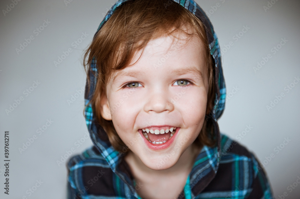 Very cheerful friendly boy laughs merrily. Very cheerful friendly boy laughs merrily.