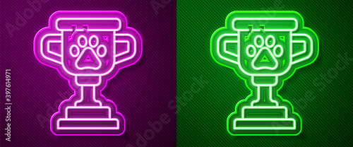 Glowing neon line Pet award symbol icon isolated on purple and green background. Medal with dog footprint as pets exhibition winner concept. Vector.