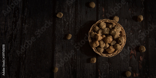 Soya chunks in basket with dark wooden background
