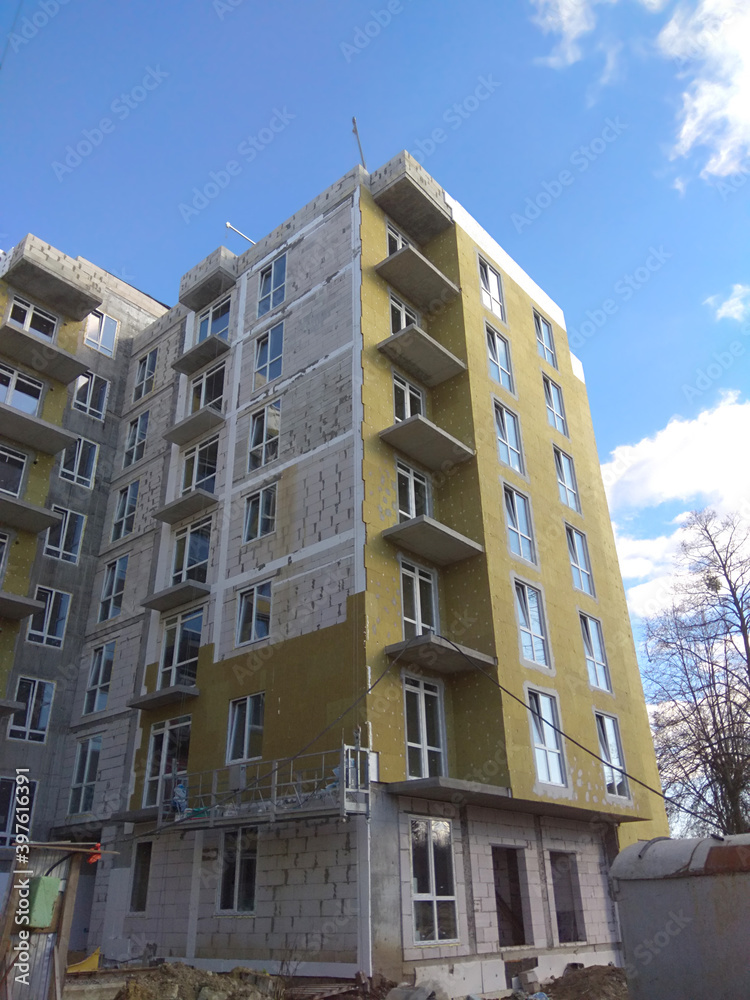 installing thermal insulation of the apartment building facade