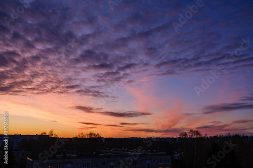 dramatatic red dark sunset over the fields and cities photo