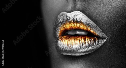 Golden lipstick closeup. Silver with Gold metal lips. Beautiful makeup. Sexy lips © Subbotina Anna