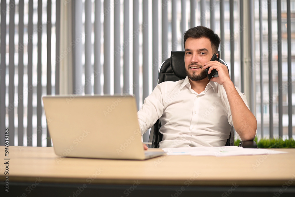 Office director talking on phone with colleagues and partners Office director talking on phone with colleagues and partners