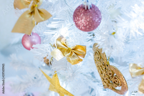 White Christmas tree with gold and pink decorations