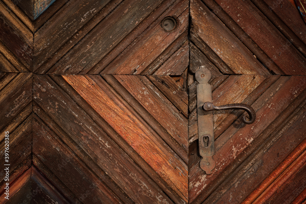 abstract background and texture, surface of vintage brown wooden door with metal lock