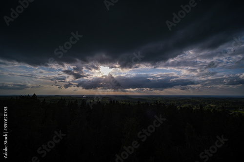 dramatatic red dark sunset over the fields and cities photo