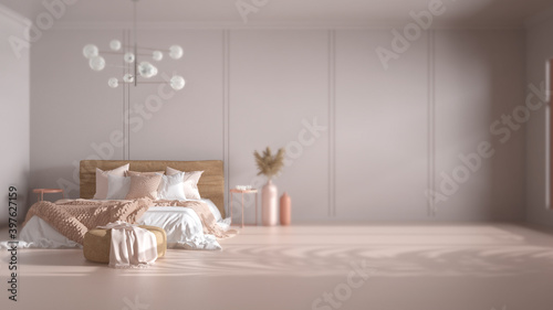 Interior design depth of field, classic background with copy space: empty bedroom, double bed with blanket, linens, pillows, pouf, decor and chandelier. Home and hotel suite concept