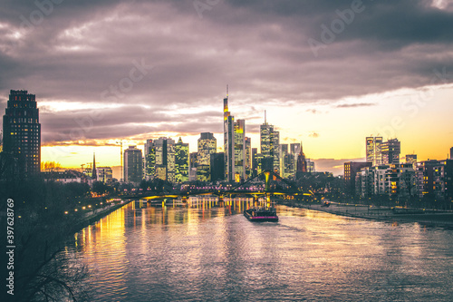 Frankfuert is the only skyline in Germany. backlit photography for sunset with a great sky and lighting in the houses. High-rise buildings  city recording and finance