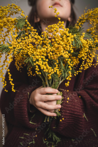 girl with mimosa bouquet