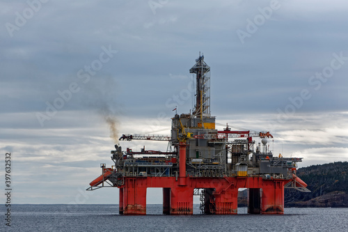 Deep water drill rig is moored near shore after finishing an exploration well, Newfoundland and Labrador, Canada.