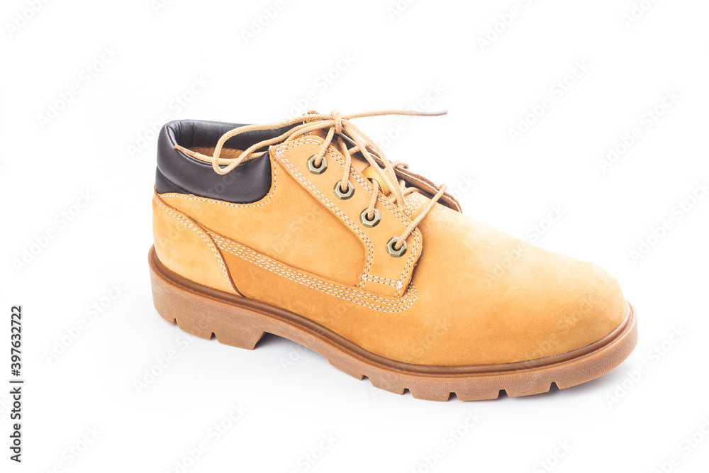 Yellow nubuck leather men's boots on white background Yellow nubuck leather men's boots on white background