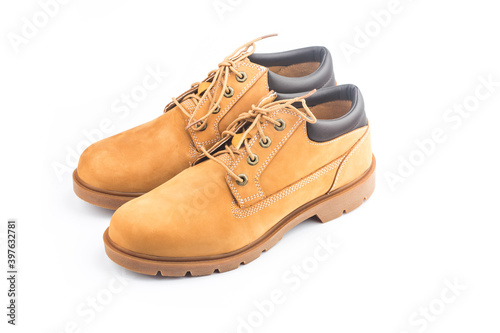 Yellow nubuck leather men's boots on white background