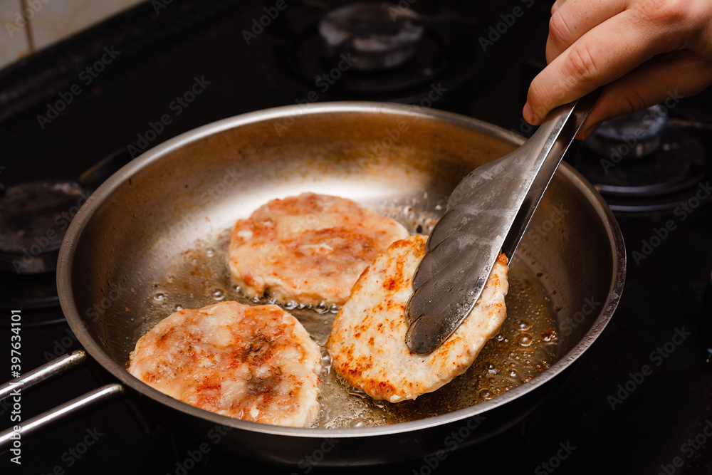 Frying the burgers in the turkey breast burger pan Frying the burgers in the turkey breast burger pan