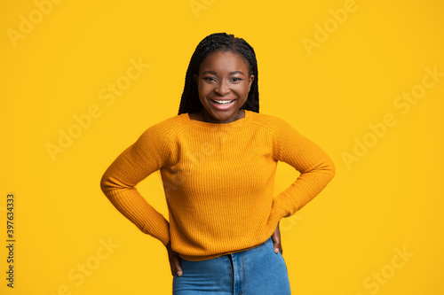 Cheerful Lady. Portrait Of Happy Smiling African American Female Over Yellow Background © Prostock-studio