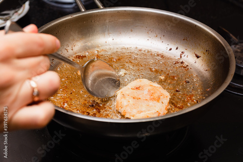 Frying the burgers in the turkey breast burger pan