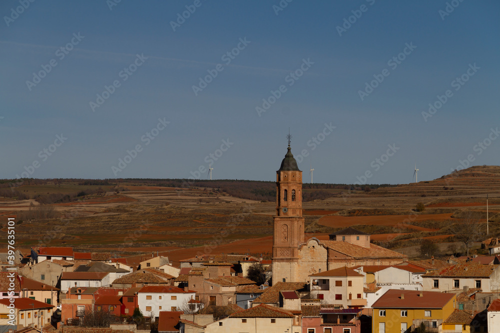 View of the Torrecilla del Rebollar town in the province of Teruel, Jiloca county, with the tower of the Church of San Cristóbal in the center