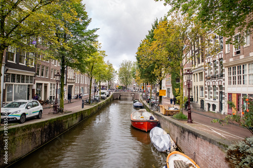 City Amsterdam in Autumn between canals #397635360