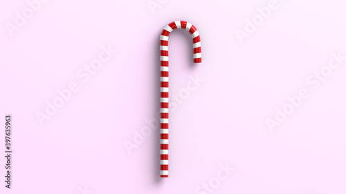 Mint hard candy canes striped in Christmas colours isolated on a pink magenta background. 