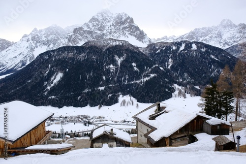 Mountain view with Sexten /Sesto village in winter scenery. Dolomites, Italy, Puster Valley / Alta Pusteria, South Tyrol. photo