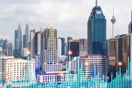 Photography Financial stock chart hologram over panorama city view of Kuala Lumpur