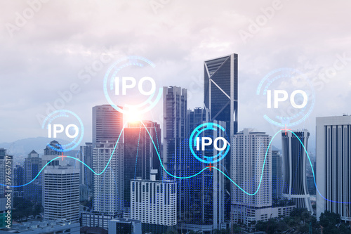 IPO icon hologram over panorama city view of Kuala Lumpur. KL is the hub of initial public offering in Malaysia, Asia. The concept of exceeding business opportunities. Double exposure.