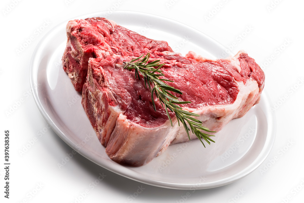 Raw T-bone steak with rosemary